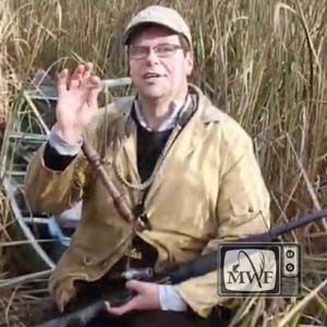 man describing duck calling in the marsh